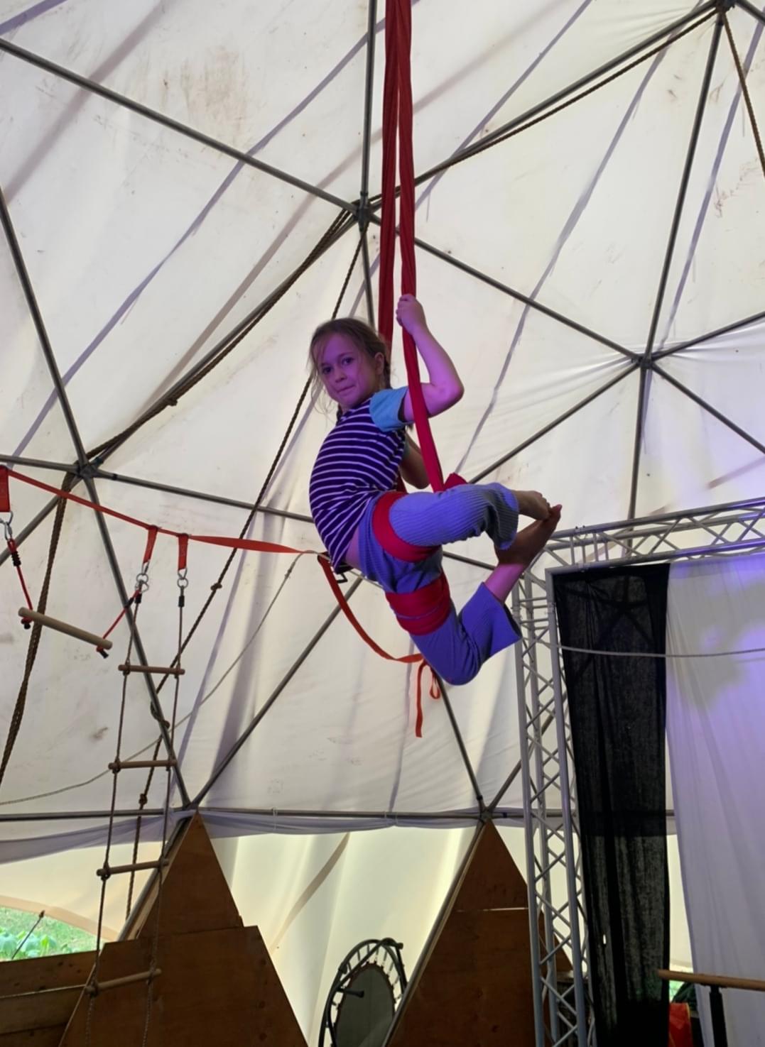 Child in Circus Tent doing Aerial,